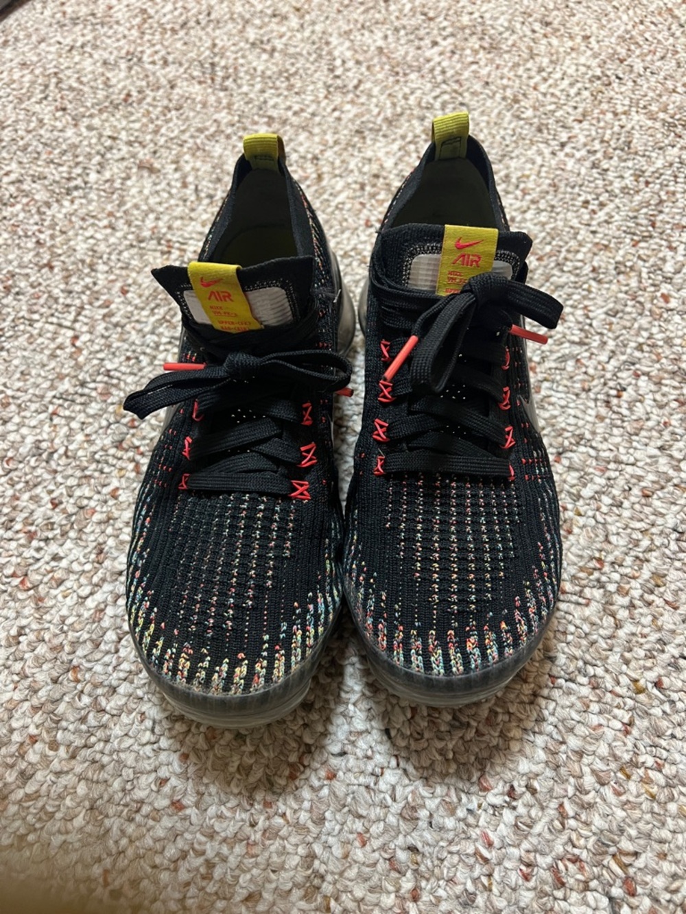 Nike Black Flyknit Sneakers with Yellow Pull Tabs